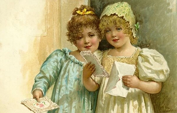 Two little girls receive a card