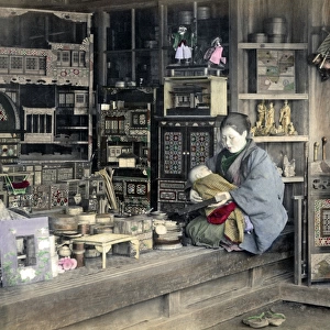 Woman with baby in curio store, Japan