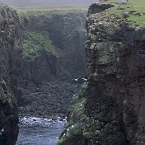 Eshaness basalt cliffs, Calders Geo, ancient volcanic crater, coast deeply eroded with caves