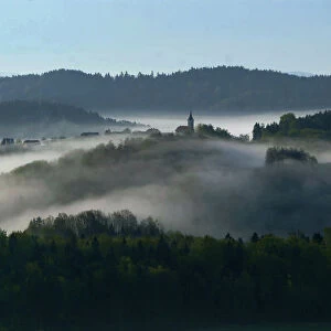 Early autumn morning fog is seen in the valleys near the village of Studencice