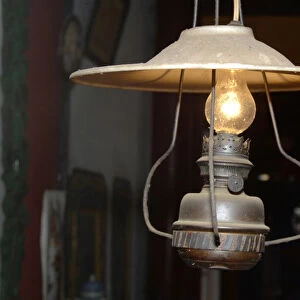Asia, Vietnam. Old kerosene lamp converted to electricity, Quan Congs Temple
