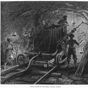 MONT CENIS TUNNEL, 1869. Men with boring machine working on the Mont Cenis railway tunnel in the Alps between France and Italy. Wood engraving, English, 1869