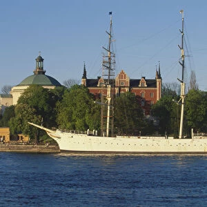 Sweden, Stockholm, af Chapman, built in 1888, the full-rigged former freighter and school ship has served as a popular youth hostel since 1949. Skeppsholmen Church, left and the Admiralty House, 1647-50, rebuilt 1844 to 1846, are in the background