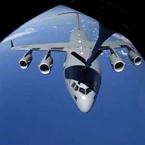 A C-17 Globemaster III receives fuel from a KC-135 Stratotanker