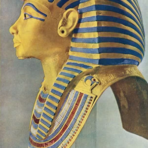 Tutankhamun. The Solid Gold Portrait Mask Which Covered The Head Of The Young Pharaohs Mummy. Egyptian Pharaoh Of The 18th Dynasty, Ruled C. 1332 Bc - 1323 Bc. From The Illustrated London News, Silver Jubilee Record Number, 1910 - 1935