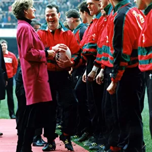Diana, Princess of Wales is introduced to the Welsh rugby team by captain Ieuan Evans