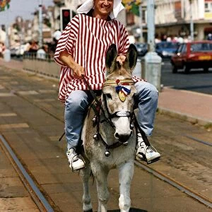 Peter Howitt Actor from BBC series "Bread"riding Donkey on Streets of